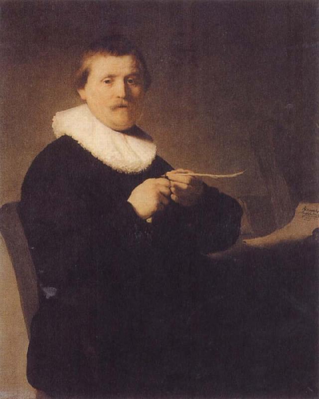 REMBRANDT Harmenszoon van Rijn Young Man Sharpening a Pen